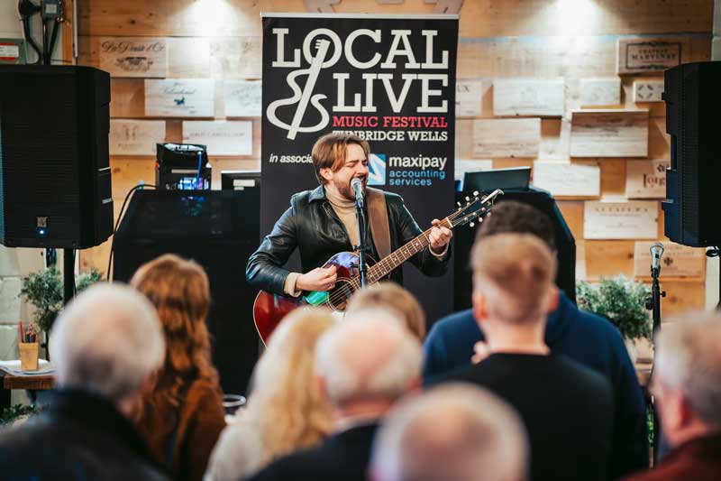 Front man of local band Suncharmer, Paul Crisp, performs at the Local & Live 2024 music festival launch party at The Old Auction House Tunbridge Wells